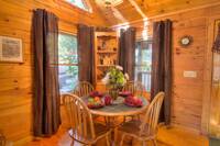 Table in the dining area of this 2 bedroom cabin in Pigeon Forge